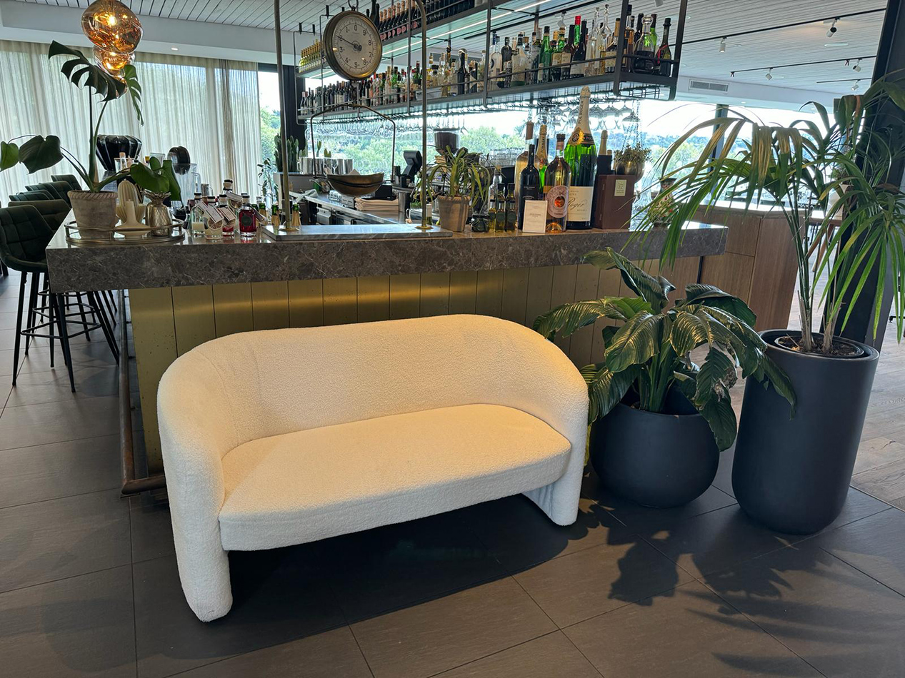 A Bouncle sofa at a bar