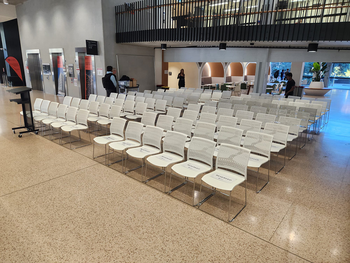 White conference chairs set up and ready for a conference
