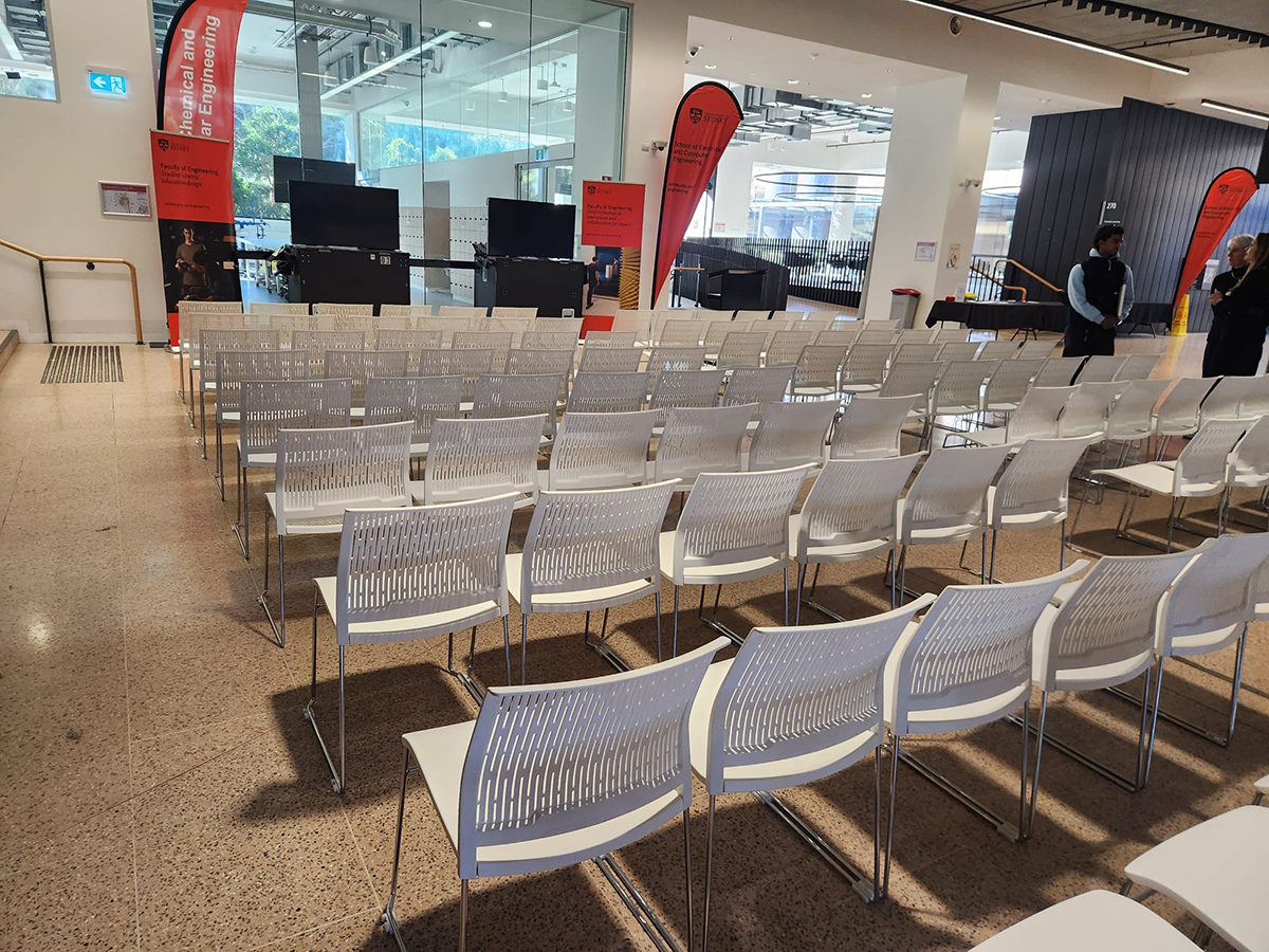Premium white conference chairs hired for an indoor conference