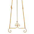 A gold metal easel adorned with a beautiful floral design.