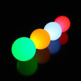 A row of colorful 40cm glow spheres on a black background.