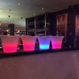 Glowing ice tub hire with three colorful lighted jugs.