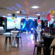A party room with tables and our white Lycra socks