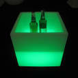 A glowing cube with two bottles inside for hire.