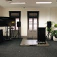 A room with a tv and speakers for an immersive audiovisual experience.