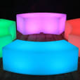 A set of vibrant lighted benches on a wooden floor.