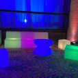 A vibrant assortment of Glow Lounge Suite Hire chairs and tables brighten up the room.