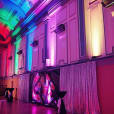 A vibrant and spacious hall illuminated with dazzling Par Can lights, setting the dance floor aglow.