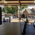 A stage set up in a school auditorium with Speaker Stands.