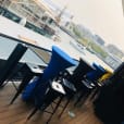 A deck bar with a scenic view of the water.