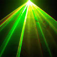 An image of a green laser light cutting through the darkness.