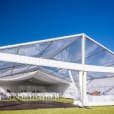 A white 6m x 9m framed marquee set up on a grassy field.