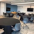 A conference room set up with black round banquet tablecloth hire.