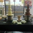 Package 3 includes a table with a chocolate fountain set up in front of it.
