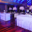 A party room with clear table and our ghost stools.