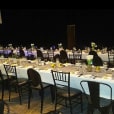 A long table set up for a formal dinner featuring Black Victorian Chairs.