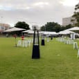 White table and chairs on a grassy area available for Tolix stool hire.