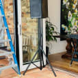 A speaker stands beside a hire door.