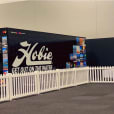 Hire a booth with a white picket fence in front of it for your event.