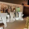 A group of white stools and a Glow Cocktail Bar table hire with lights.