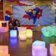 "Superman themed birthday party with Glow Cylinder seating hire.