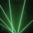 Hire a green laser light for your stage in a dark room.