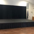 Our black drape backdrop being used on a stage