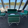 A green ivy wire sofa lounge set inside of a boat