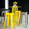 Yellow wire cocktail table with Tolix stools