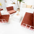 White Rectangular Coffee Table next to a red velvet lounge