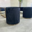 Two black velvet ottoman stools