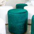 Close-up of the green velvet ottoman stool