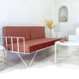 White wire sofa lounge with pink velvet cushions