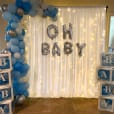 Ou silk white backdrop drapes being used at a baby shower