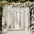 Our silk white drapes being used as a backdrop at a wedding reception