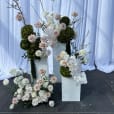 White plinths used for flower decorations