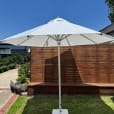 Our market umbrella near an outdoor lounge area