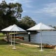 Our market umbrellas on a lake edge
