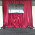 A red velvet drape used on a stage