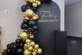Stylish balloon garland for a birthday with golden black balloons