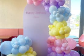 Our white inscribed balloon  garland with yellow blue and pink balloons