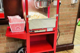 A popcorn machine with a movable card