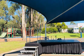 A stage that was hired for a party at a park