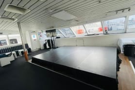 A stage hired and set up inside of a large boat