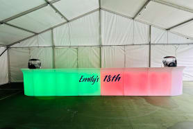 A long glowing bar with writing on it