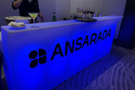 A blue bar being used a corporate event