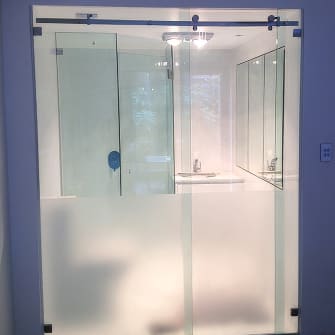 Glass sliding doors on a residential bathroom