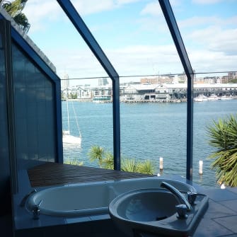 A new glass roof on a bathroom near a river