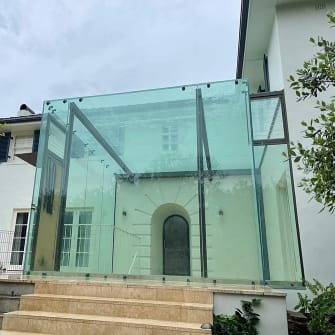 A glass roof and entry area for a hotel