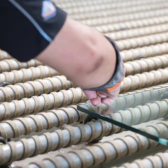 A Palmers Glass worker checking some supply only glass